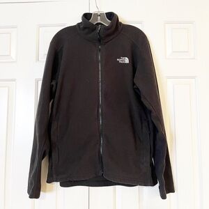 The North Face Men's black fleece full-zip jacket with pockets. Medium